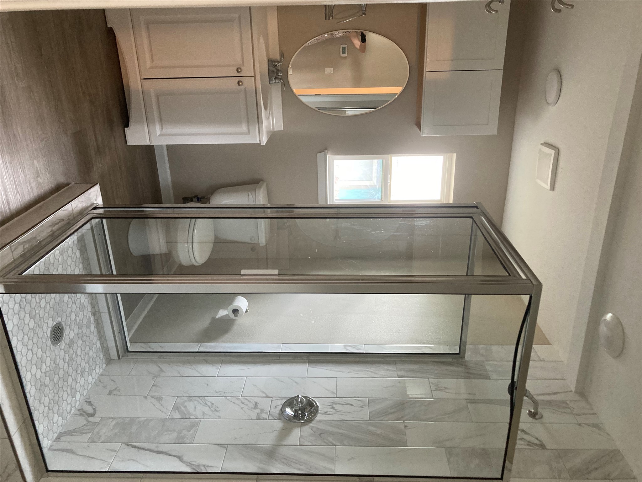 7307 Thannas Way Austin, TX 78744 - Photo 5 of 13 Bathroom featuring vanity, a shower stall, and dark wood finished floors
