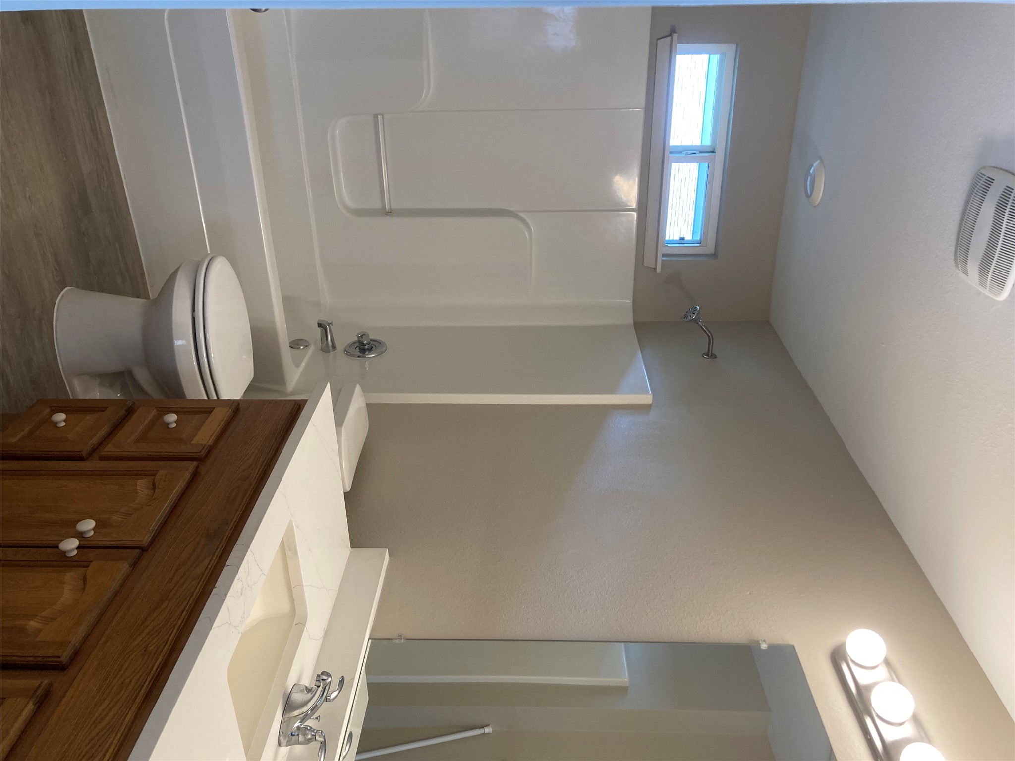 7307 Thannas Way Austin, TX 78744 - Photo 8 of 13 Full bathroom featuring vanity, dark wood-style flooring, and shower / tub combination