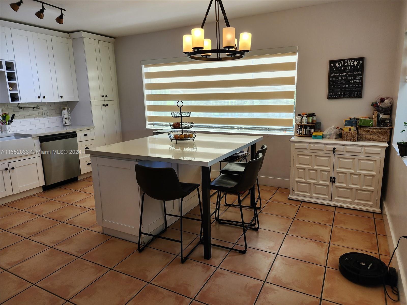 11866 Southwest 43rd Street Miami, FL 33175 - Photo 11 of 64 a kitchen with stainless steel appliances a sink and cabinets
