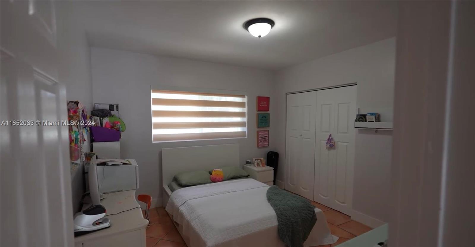 11866 Southwest 43rd Street Miami, FL 33175 - Photo 12 of 64 a room with a bed and a window