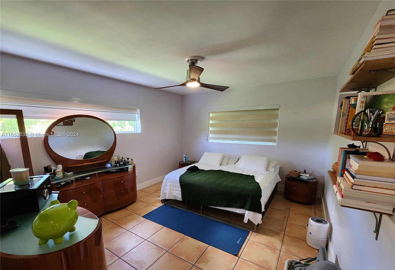 11866 Southwest 43rd Street Miami, FL 33175 - Photo 15 of 64 a living room with furniture a window and gym equipment