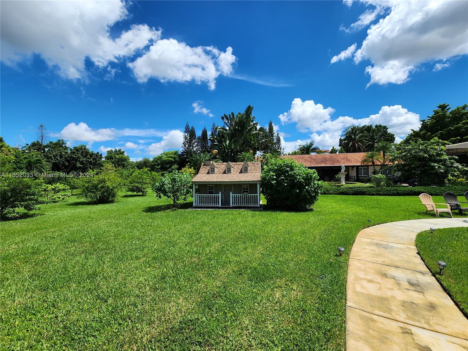 11866 Southwest 43rd Street Miami, FL 33175 - Photo 18 of 64 a view of a house with a big yard