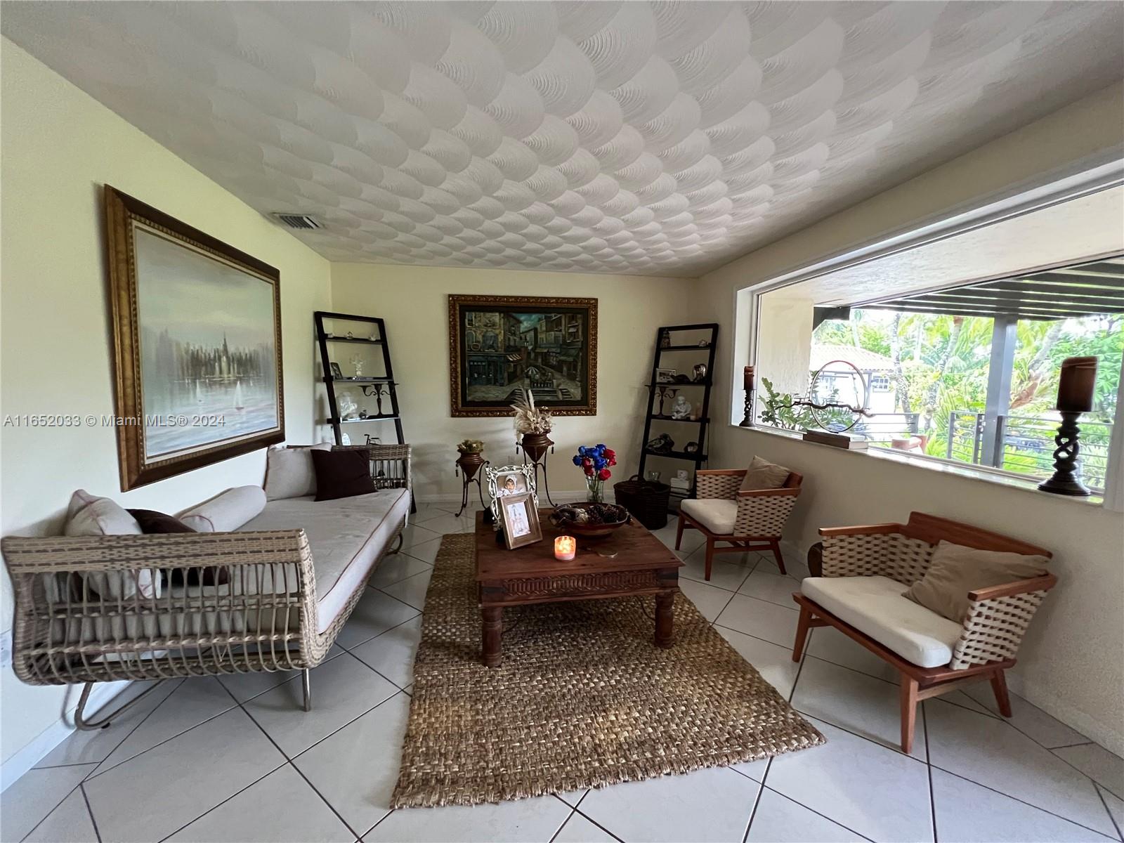 11866 Southwest 43rd Street Miami, FL 33175 - Photo 26 of 64 a living room with furniture and a large window