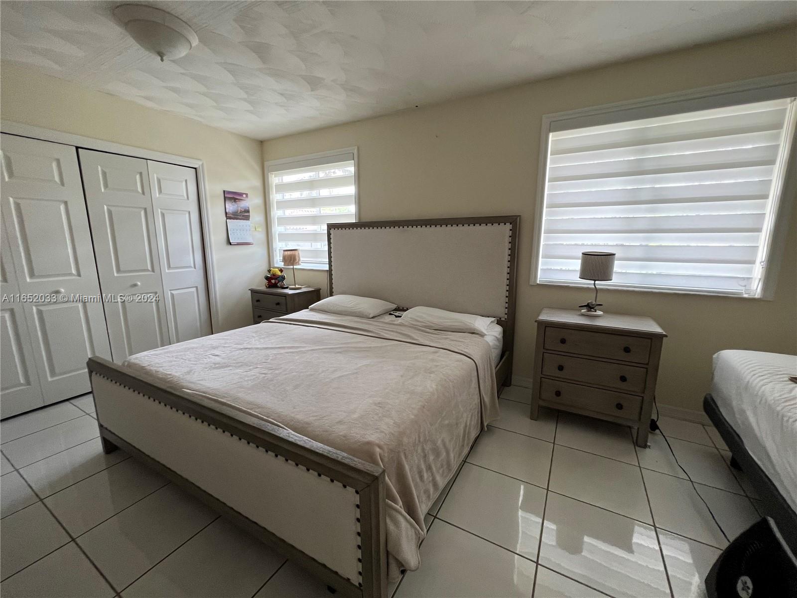 11866 Southwest 43rd Street Miami, FL 33175 - Photo 33 of 64 a bed room with a bed and a window