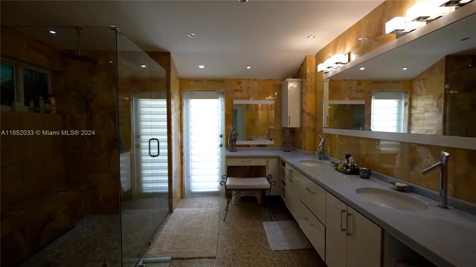 11866 Southwest 43rd Street Miami, FL 33175 - Photo 39 of 64 a bathroom with a double vanity sink and a mirror