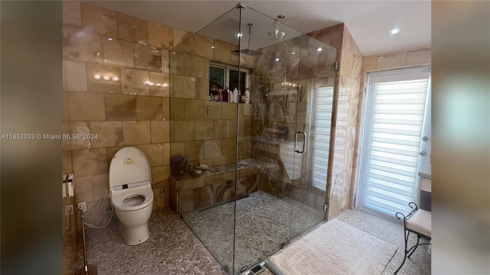 11866 Southwest 43rd Street Miami, FL 33175 - Photo 40 of 64 a bathroom with a toilet and a shower