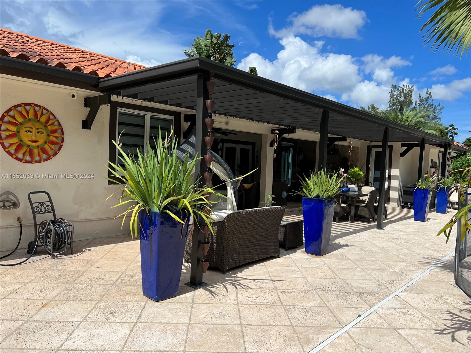 11866 Southwest 43rd Street Miami, FL 33175 - Photo 43 of 64 a view of a patio with potted plants