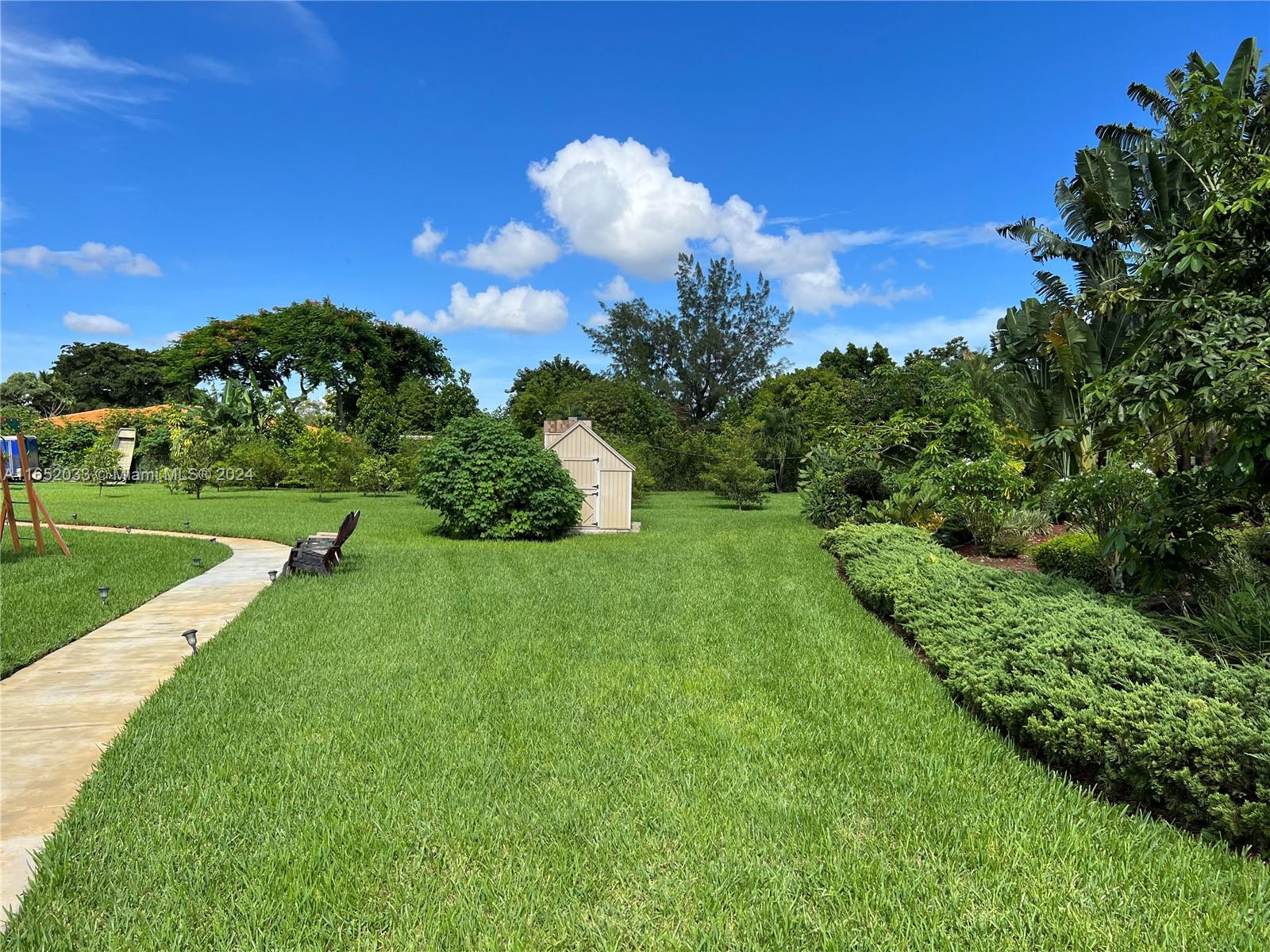 11866 Southwest 43rd Street Miami, FL 33175 - Photo 60 of 64 a view of a house with a big yard