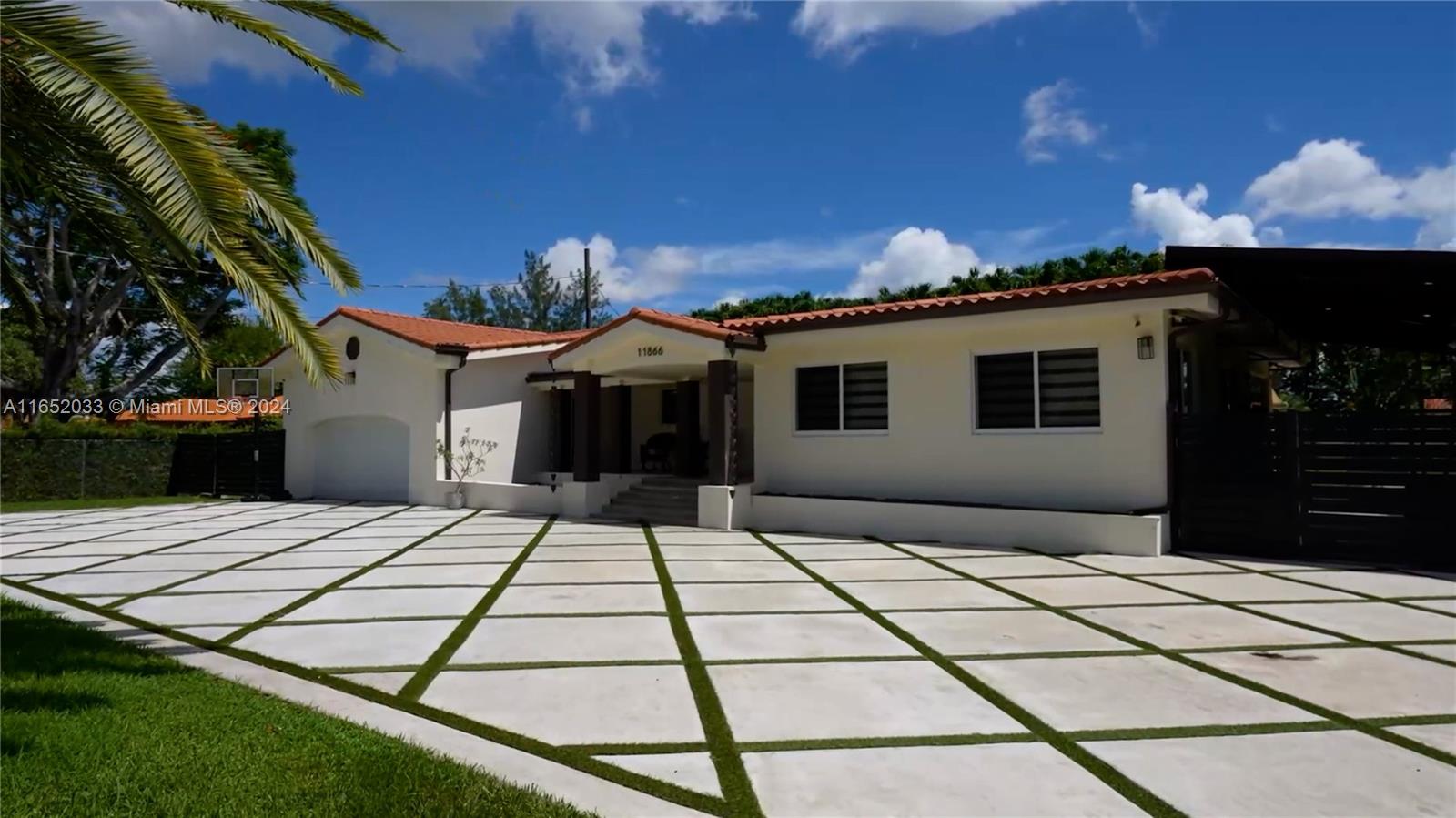 11866 Southwest 43rd Street Miami, FL 33175 - Photo 6 of 64 a backyard of a house with yard and outdoor seating