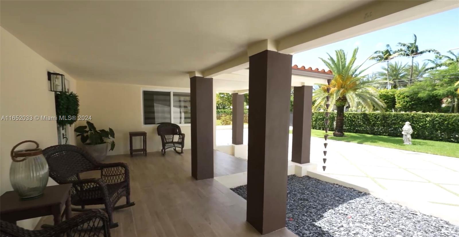 11866 Southwest 43rd Street Miami, FL 33175 - Photo 8 of 64 a living room with patio furniture and a garden