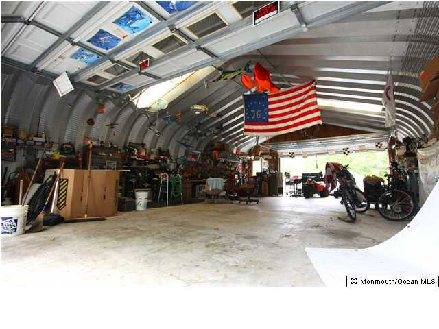 143 Lanes Pond Road Howell, NJ 07731 - Photo 2 of 3 a view of parking garage with cars