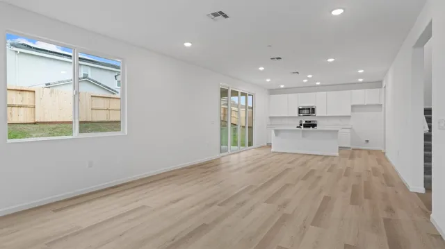 a view of a kitchen with a sink and a window