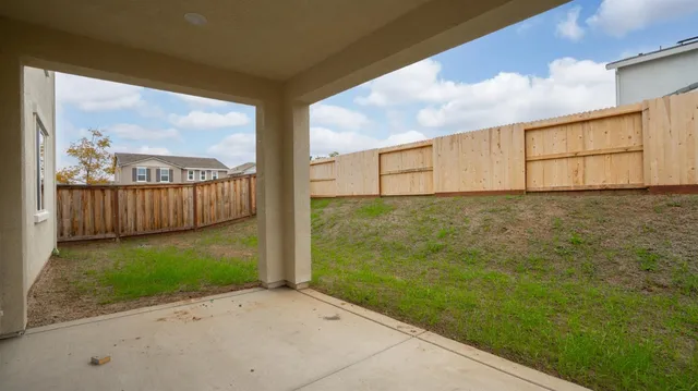 a view of a pathway with a yard