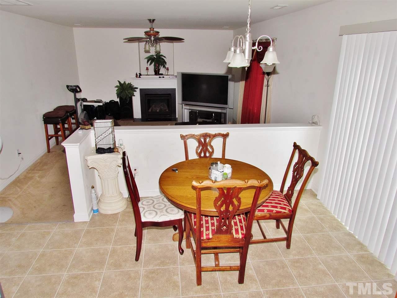 5200 Chasteal Trail Raleigh, NC 27610 - Photo 11 of 25 a view of a dining room with furniture