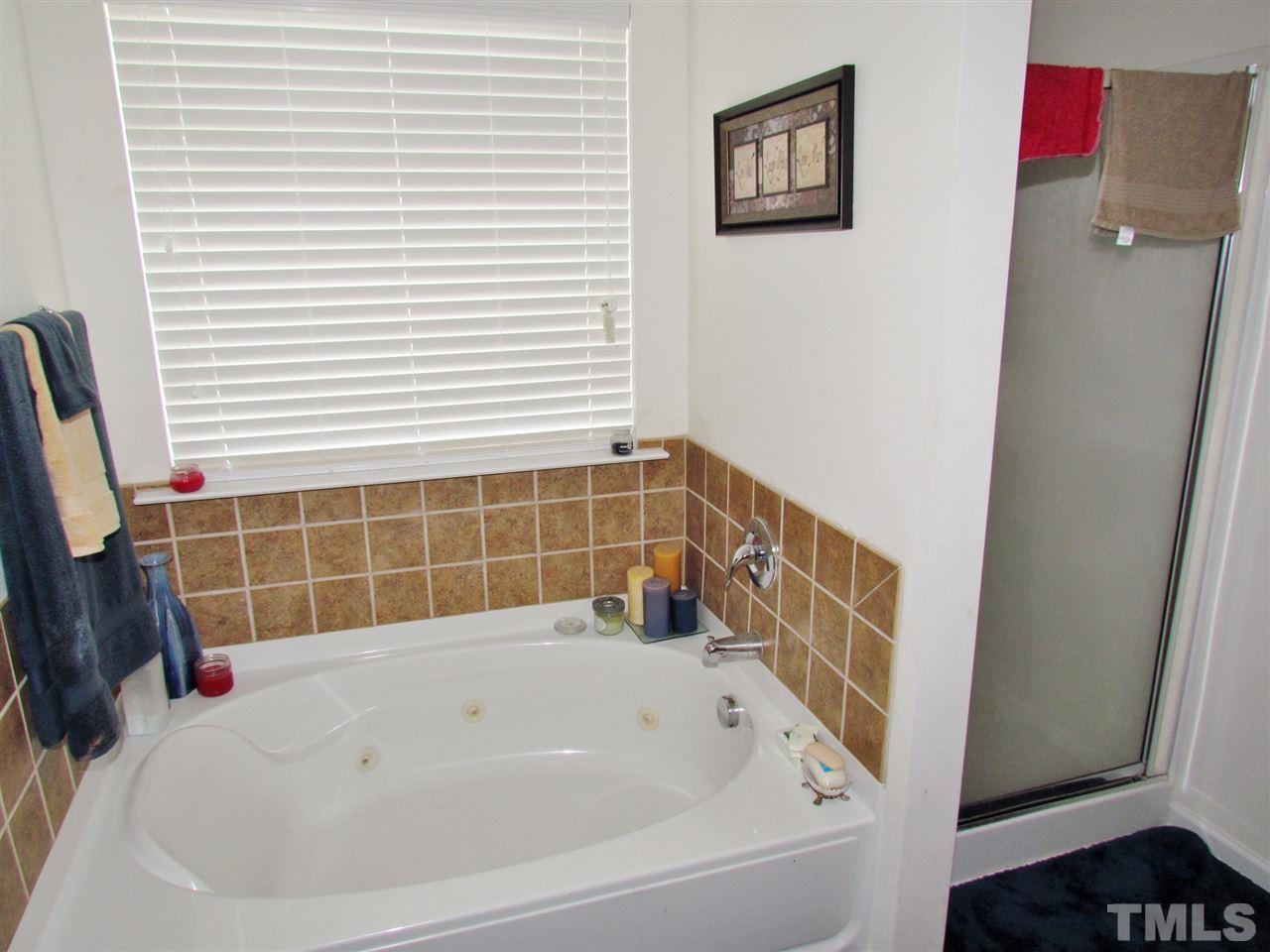 5200 Chasteal Trail Raleigh, NC 27610 - Photo 16 of 25 a bathroom with a bathtub
