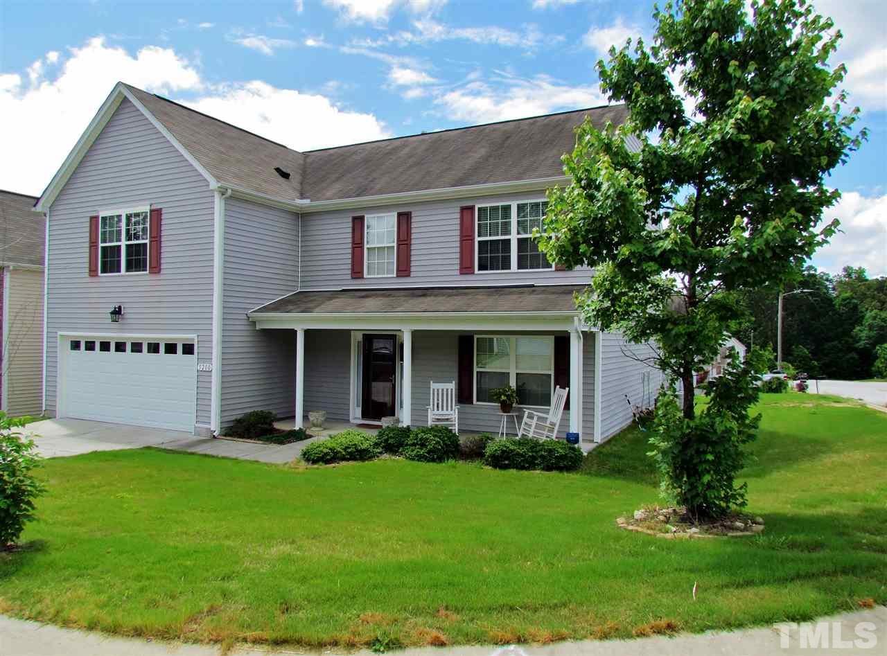 5200 Chasteal Trail Raleigh, NC 27610 - Photo 2 of 25 a front view of a house with a garden and plants