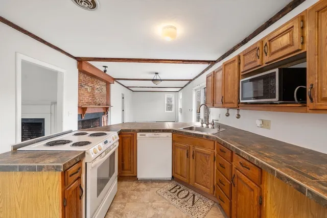 a utility room with sink dryer and washer