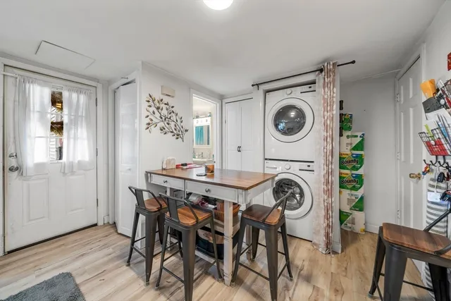 a kitchen with kitchen island white cabinets and white appliances