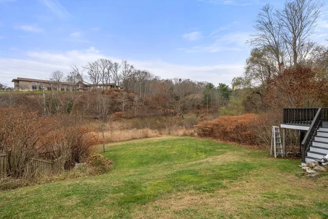 a backyard of a house with lots of green space