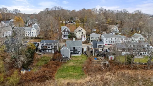 a view of a town with mountains in the background