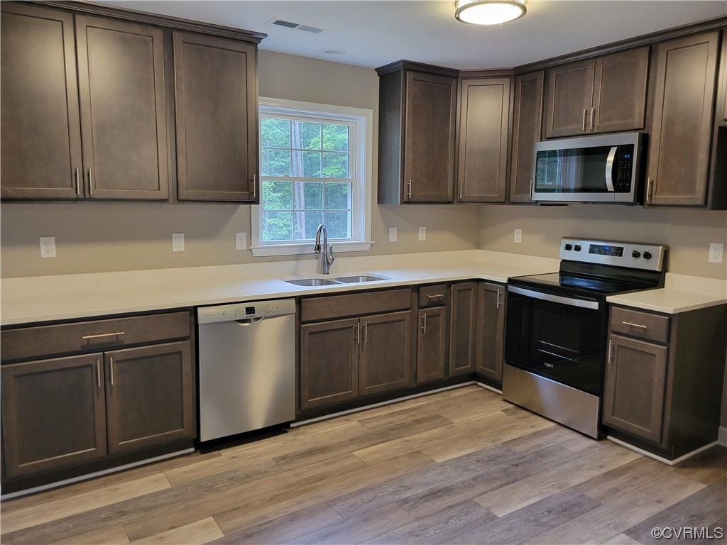 205 Johnson Road Mineral, VA 23117 - Photo 5 of 18 a kitchen with stainless steel appliances granite countertop a sink stove and microwave