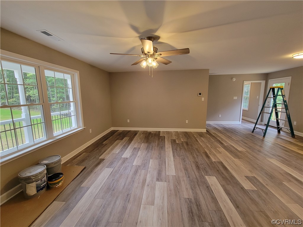 205 Johnson Road Mineral, VA 23117 - Photo 7 of 18 wooden floor in an empty room with a window