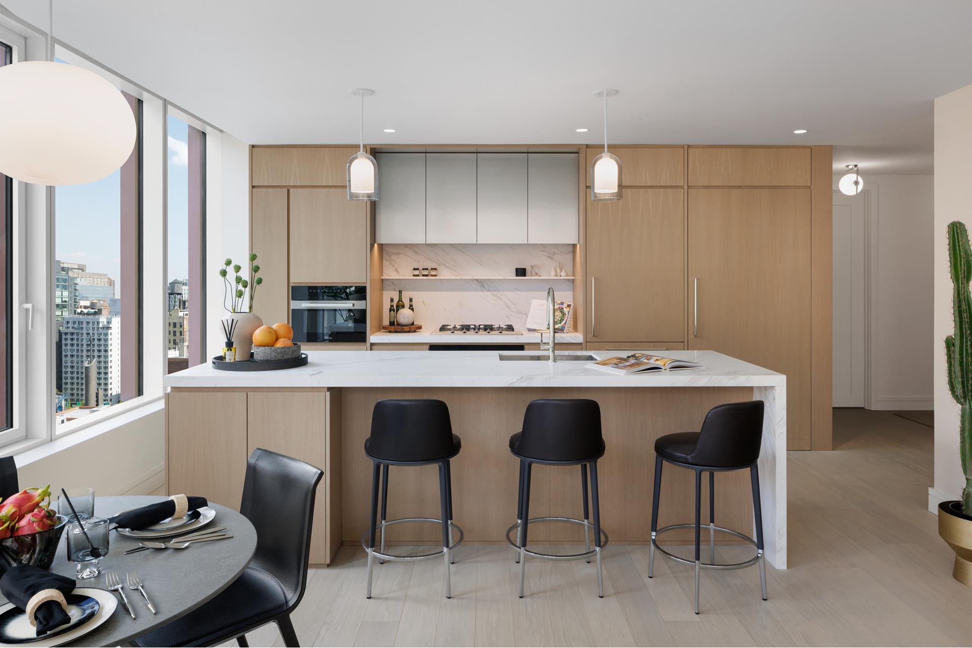 200 East 20th Street, Unit 12B Manhattan, NY 10003 - Photo 1 of 19 a kitchen with a sink cabinets and window
