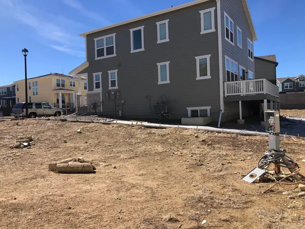 a view of a house with snow on the road