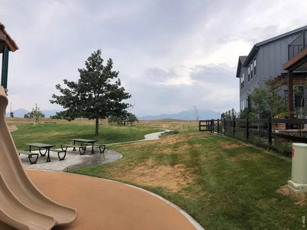 swimming pool with outdoor seating and garden