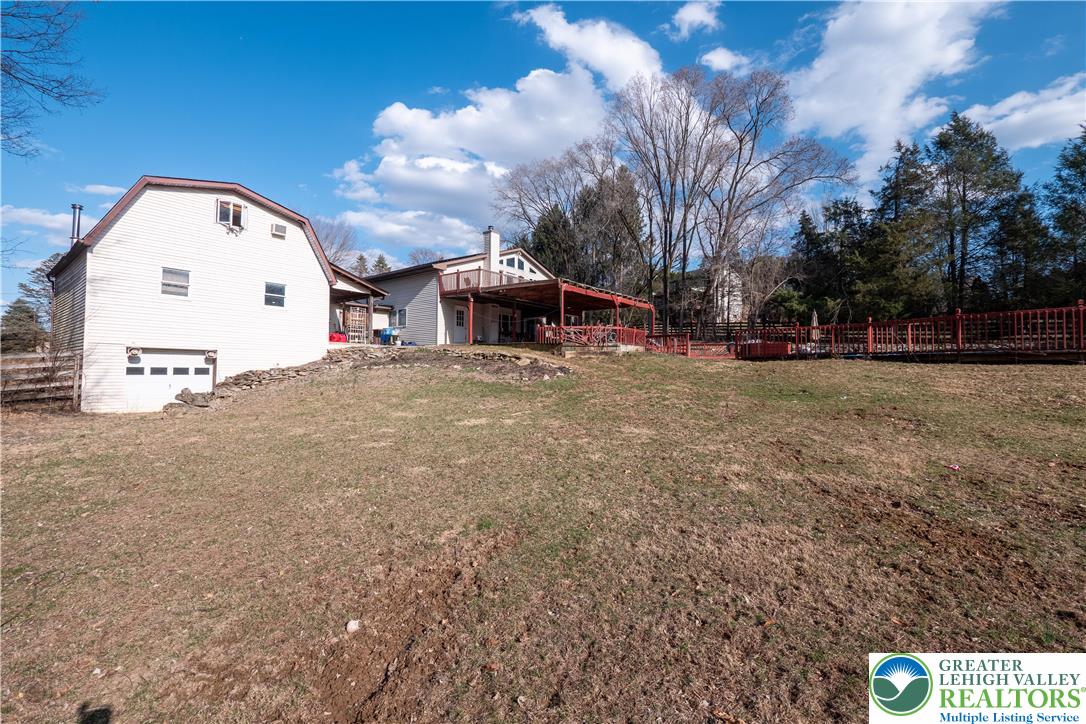 120 Royal Manor Road Easton, PA 18042 - Photo 40 of 49 a view of a white house with a yard