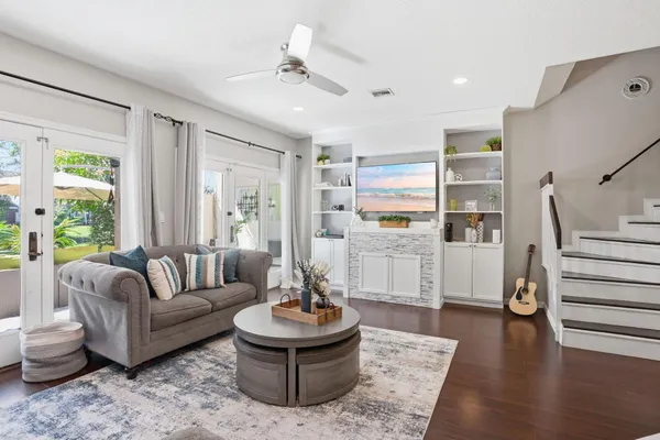 a living room with furniture and a large window