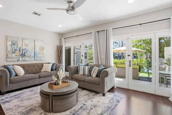 a living room with furniture and a large window