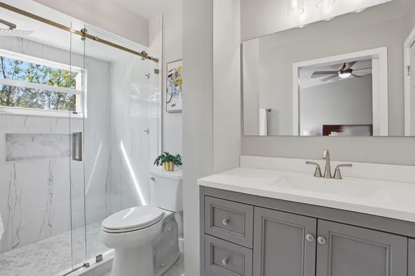 a bedroom with a bed and a dresser