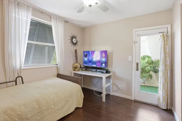a view of a bedroom with furniture