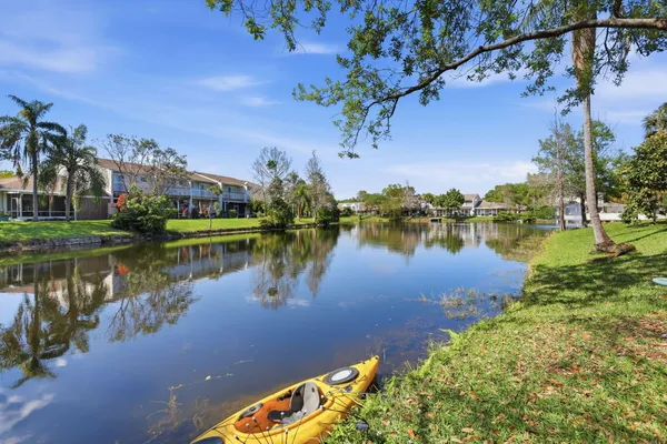 a view of a house with a yard and plants