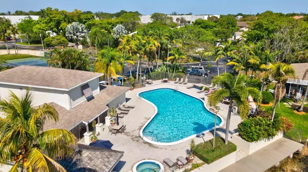 an aerial view of residential house with outdoor space and swimming pool