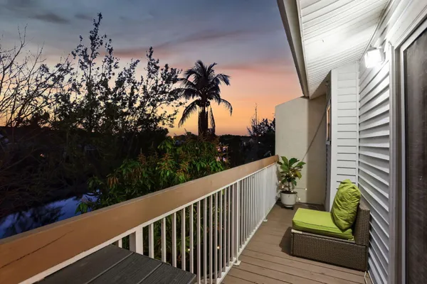 a view of a balcony with chairs
