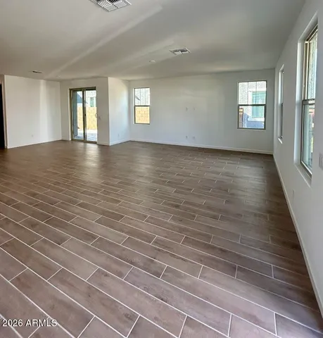 a view of kitchen with cabinets and wooden floor
