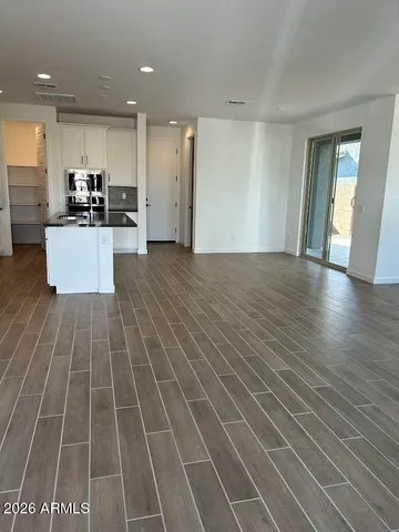 a front view of a house with wooden fence