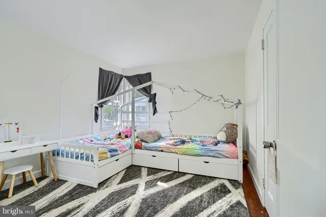 a bed room with a bed and a table