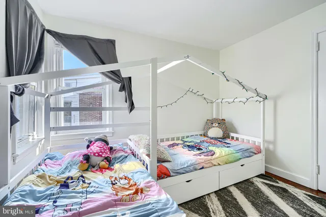 a bed room with a bed and a table