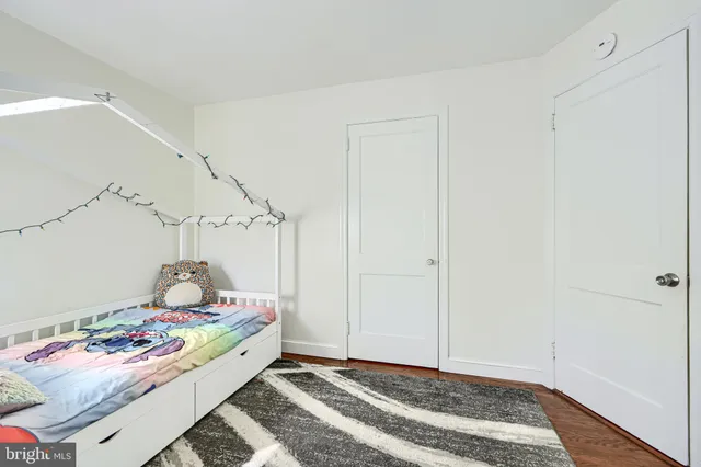 a bedroom with bed and window