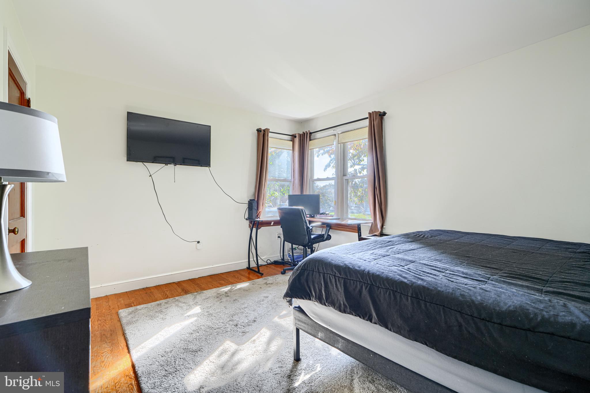 741 South Russell Street York, PA 17402 - Photo 23 of 32 a bedroom with a bed and wooden floor