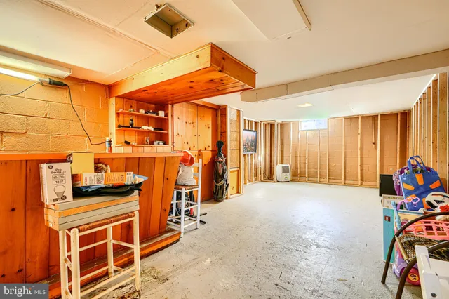 a view of a room with furniture and windows