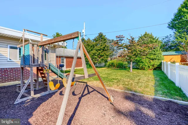 a view of a yard with furniture and sitting area