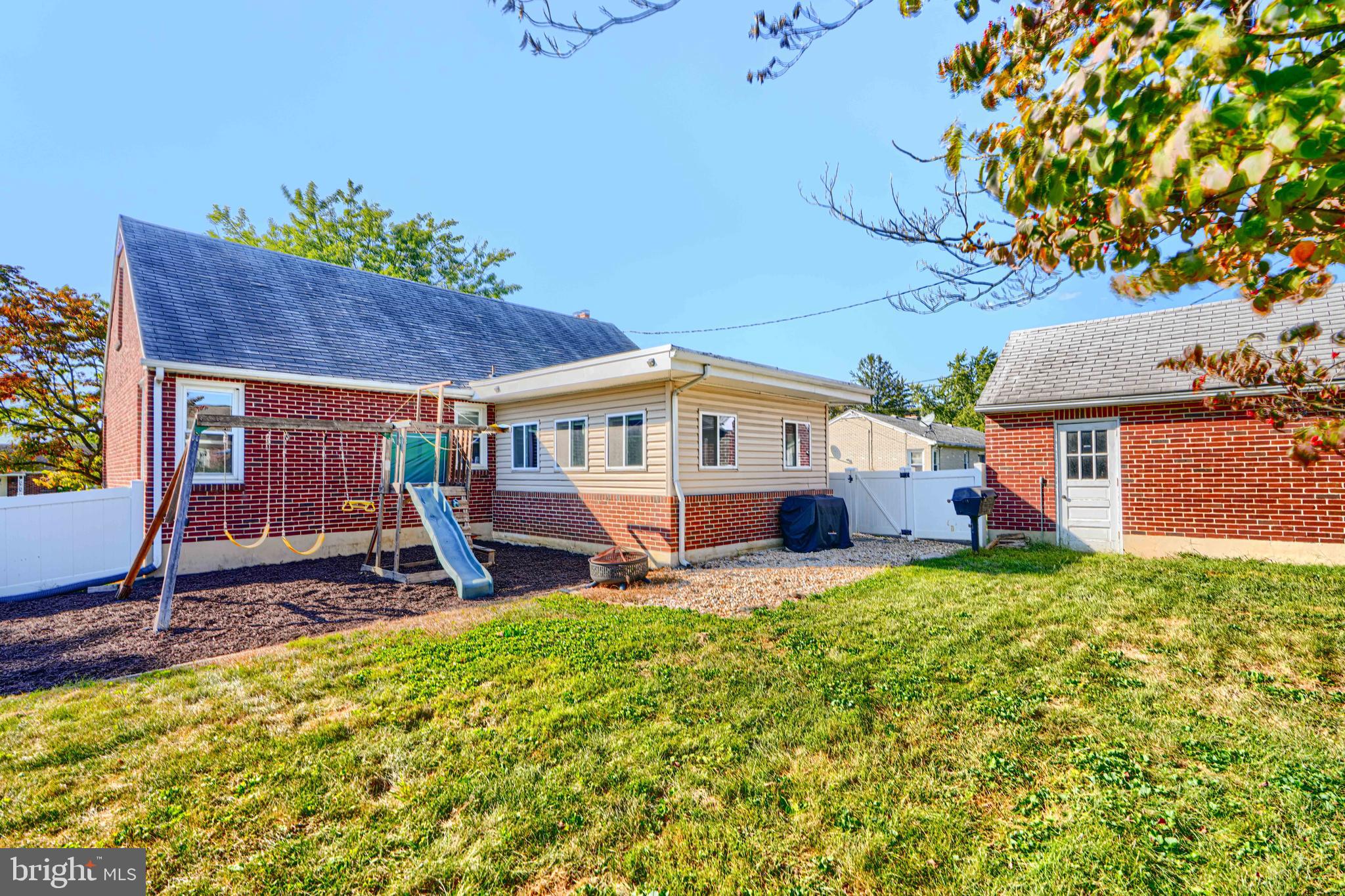 741 South Russell Street York, PA 17402 - Photo 7 of 32 a front view of a house with a yard porch and sitting area