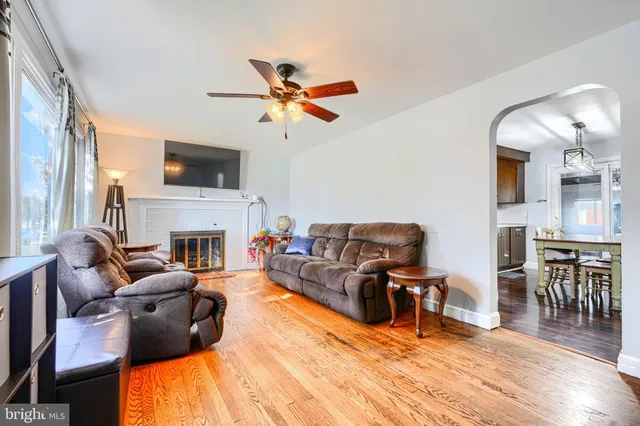a living room with furniture fireplace and a flat screen tv