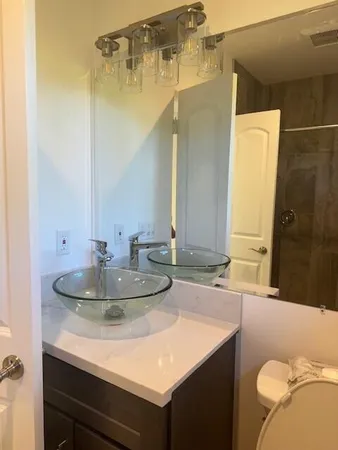 a bathroom with a shower and toilet