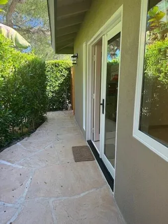 a kitchen with a refrigerator and a sink