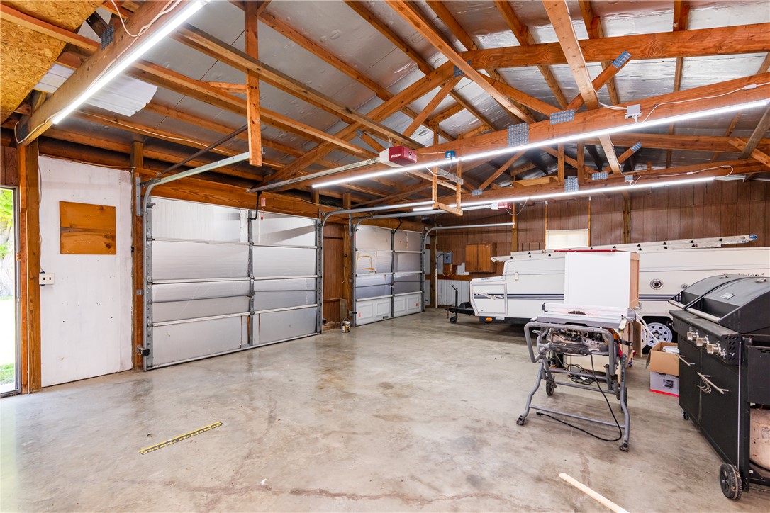 1217 Jasper Road Xenia, OH 45385 - Photo 52 of 62 Spacious garage with multiple doors provides ample space for vehicles and storage.